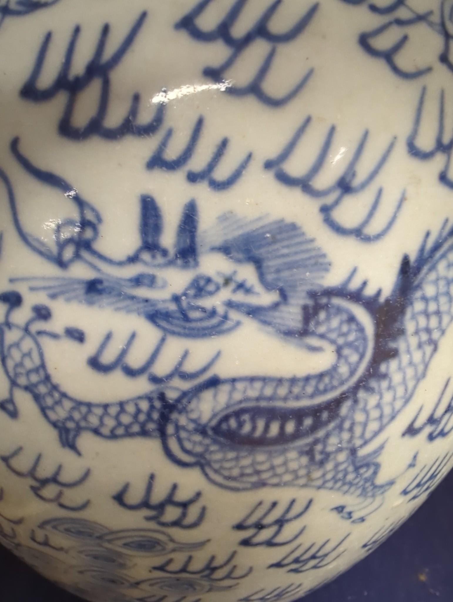 An 18th century Chinese provincial blue and white ‘dragon and phoenix’ jar, 19cm